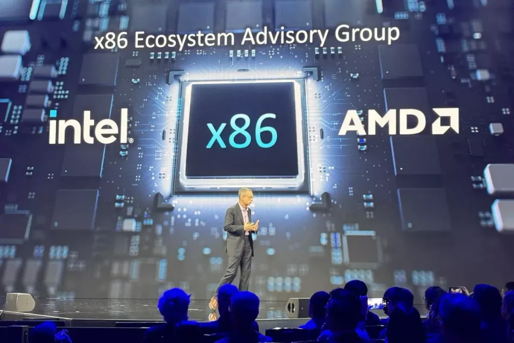 Presentación del x86 Ecosystem Advisory Group con logotipos de Intel y AMD en pantalla gigante